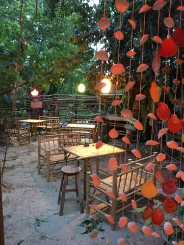 a bunch of red umbrellas hanging over a table at Freedom home in Ko Chang