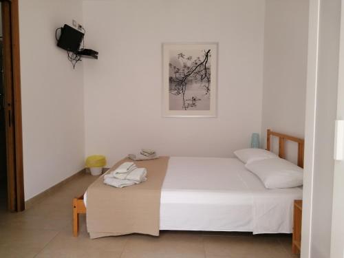 Ein Bett oder Betten in einem Zimmer der Unterkunft La casa di Alice