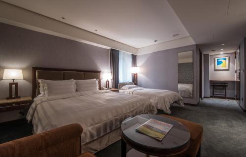 Katil atau katil-katil dalam bilik di Royal Biz Taipei Hotel