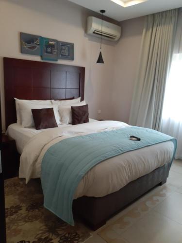 Ένα ή περισσότερα κρεβάτια σε δωμάτιο στο Ace Premier Hotel