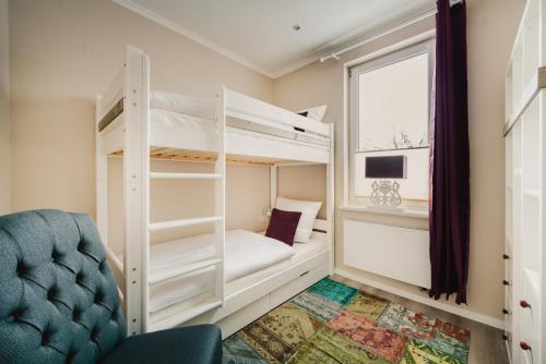 Двухъярусная кровать или двухъярусные кровати в номере Casa Bella Cosa