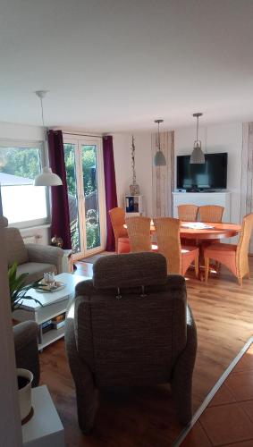 a living room with a couch and a table at Haus der 16 Seen in Krakow am See