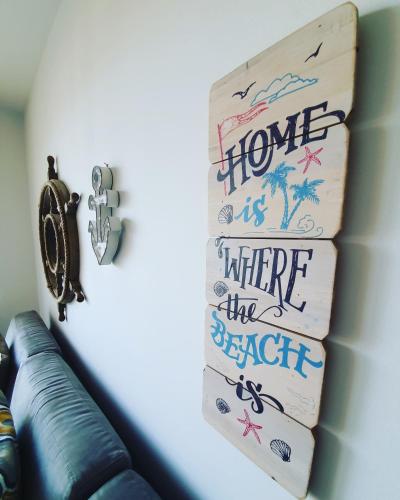 a book shelf with a home is where the beach is at Charming apartment near beach in Sveti Stefan