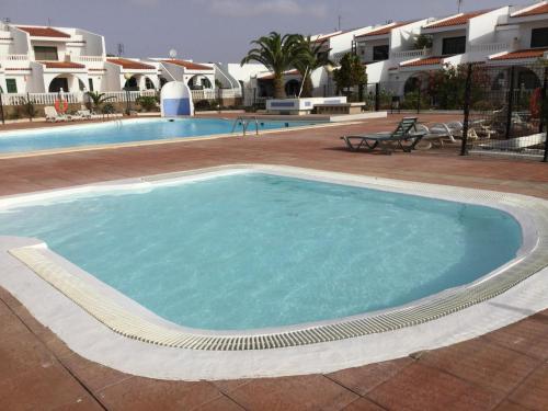 a large pool with blue water in a resort at Costa Antigua in Costa de Antigua