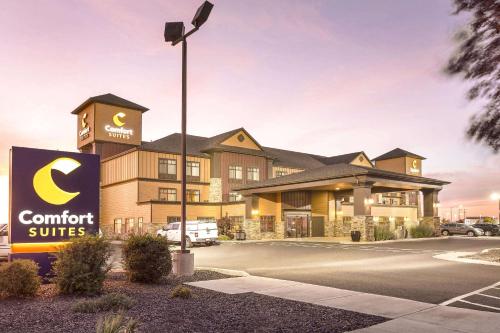 a hotel with a sign in front of a building at Comfort Suites Moses Lake in Moses Lake
