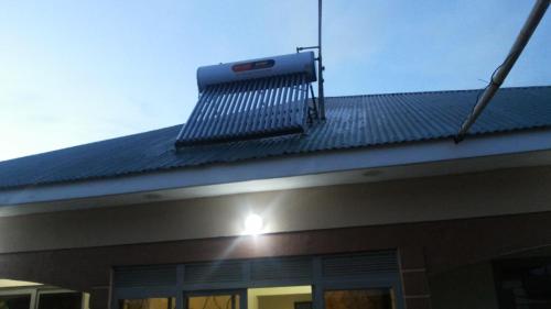 a solar panel on the roof of a building at Hotel Premier in Yumbe
