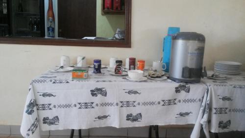 a table with a table cloth on it with aperature at Hotel Premier in Yumbe