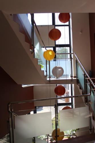 a staircase with colorful lights hanging from a ceiling at Motel Kurortnyy & SPA in Shklo