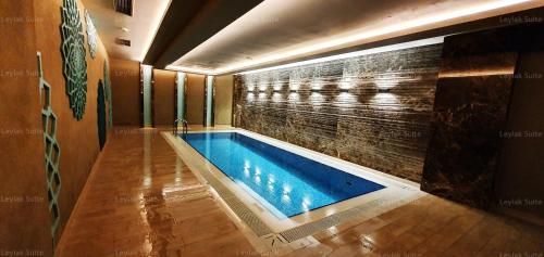 a swimming pool in a room with a brick wall at Taksim leylak suite in Istanbul