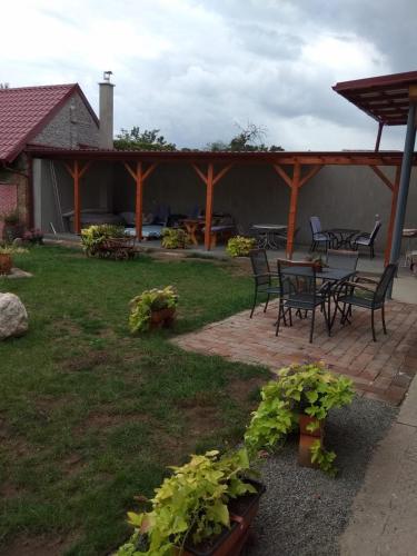 a patio with chairs and a table and chairs at Apartmány U splavu in Veselí nad Moravou