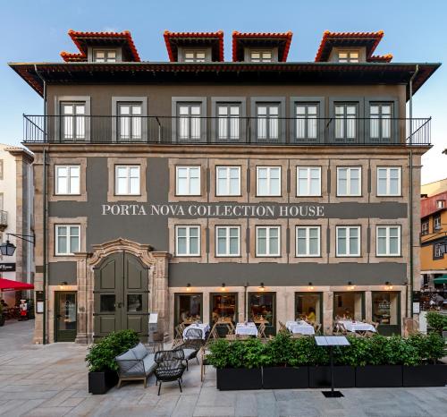 a building with a restaurant in front of it at Porta Nova Collection House in Braga