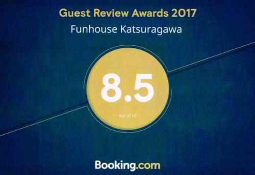 a sign that says guest review awards with the number eight at Funhouse Katsuragawa in Kyoto