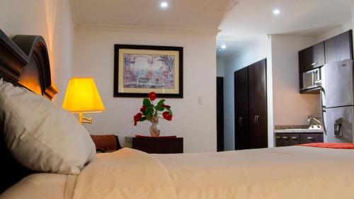 Postel nebo postele na pokoji v ubytování Gran Hotel CCP Suites