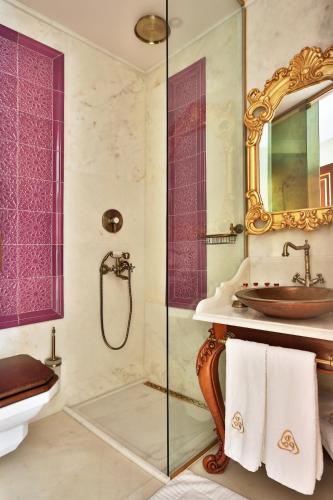 a bathroom with a sink and a shower at Daru Sultan Hotels Galata in Istanbul