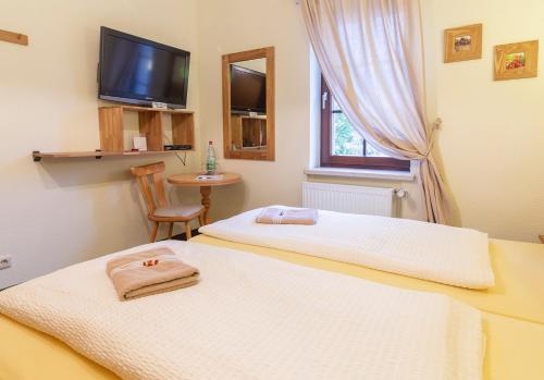 Cama o camas de una habitación en Landpension Minna