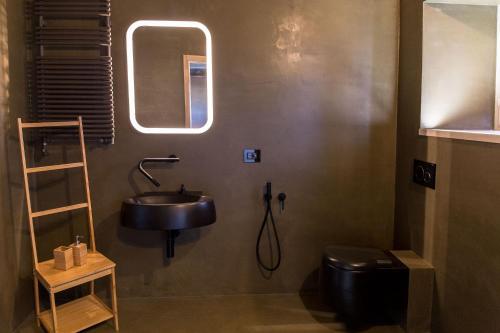 a bathroom with a sink and a toilet at Villa Fortezza Antique Rooms in Ascoli Piceno