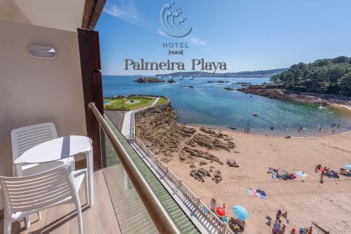 a balcony with a view of a beach at Hotel Norat Palmeira Playa in Ribeira