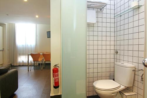a bathroom with a toilet in a room at Classbedroom Born Apartments in Barcelona
