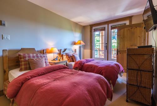 Cama o camas de una habitación en L'Équinoxe Rendez-Vous Mont-Tremblant