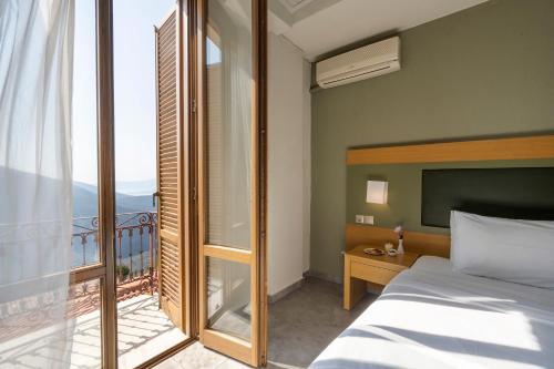 Postel nebo postele na pokoji v ubytování Kastalia Boutique Hotel