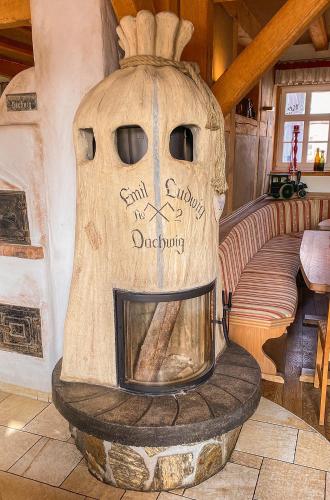 a large wooden oven in a room with a table at Hotel Restaurant Mühlenhof Bosse in Dachwig