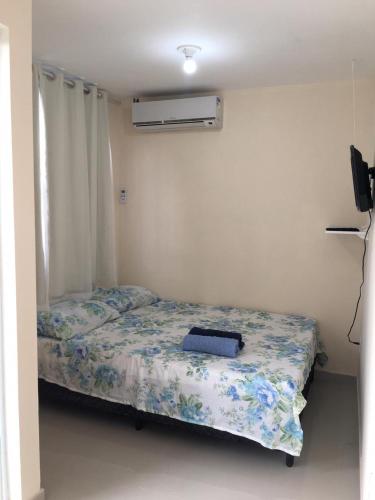 a bedroom with two beds in a room at Pousada Alto de Junqueira in Mangaratiba