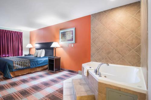 Ένα ή περισσότερα κρεβάτια σε δωμάτιο στο Americas Best Value Inn - Mableton