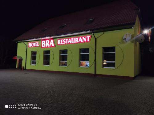 a green building with a sign that reads hotel bra restaurant at Bra Haus in Branev