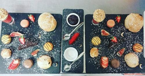 a group of pastries and strawberries on a tray at Heywood Spa Hotel in Tenby