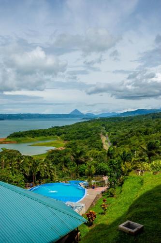 an aerial view of a resort with two swimming pools at Lake Arenal Condos in Naranjos Agrios