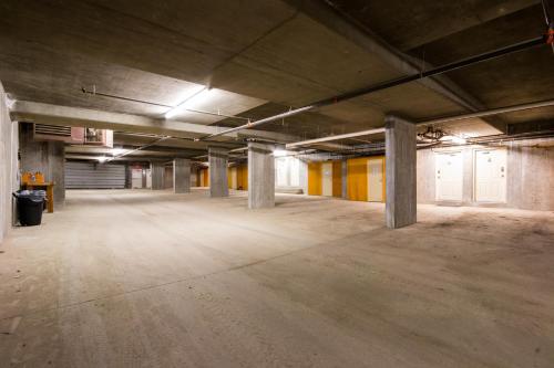 an empty parking lot in an old building at 3 BR 3 Bath ski in ski out with private hot tub in Big White
