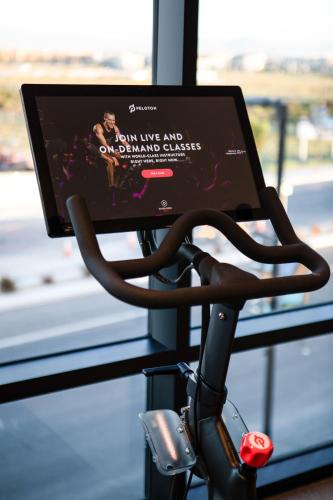 a computer monitor on a bike with a movie on it at Ayres Hotel San Diego South - Chula Vista in Chula Vista