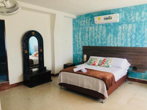 A bed or beds in a room at HOTEL GIRON CAMPESTRE