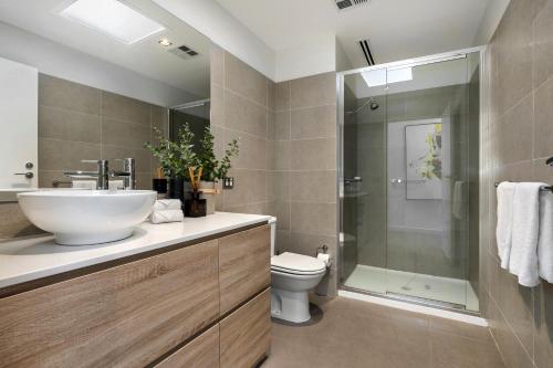 a bathroom with a sink and a toilet and a shower at Saltwater Apartment Sorrento in Sorrento