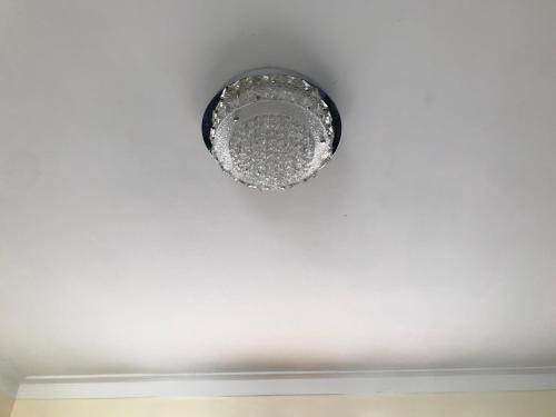a ceiling light on a white ceiling at cómodo first floor in Santiago de los Caballeros