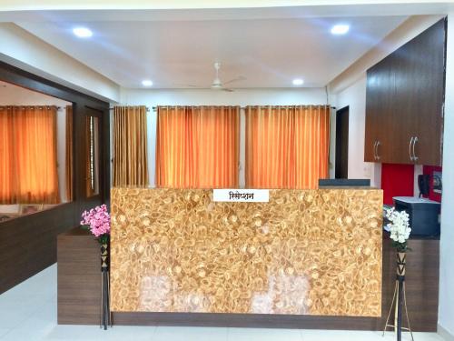 a view of the reception desk in a room at Hotel Shiva's Inn in Trimbak