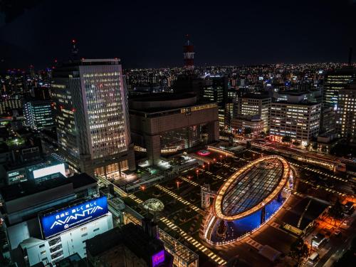 a view of a city at night at Sotetsu Fresa Inn Nagoya Sakuradoriguchi in Nagoya
