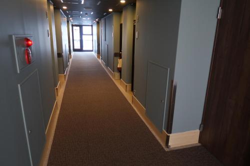 a hallway of an office building with a long corridor at Ueno Touganeya Hotel in Tokyo