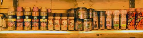 a row of old glass bottles on a shelf at Cheetah Holiday Club in Vizovice