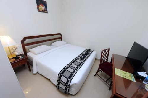 Postel nebo postele na pokoji v ubytování Palm Inn Ampang Point