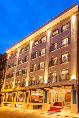 a large building with stairs in front of it at Mukarnas Taksim Hotel in Istanbul
