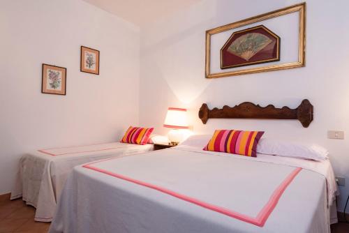 Katil atau katil-katil dalam bilik di Agriturismo La Rombaia