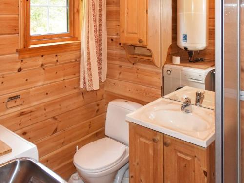 a bathroom with a toilet and a sink at 4 person holiday home in olden in Olden