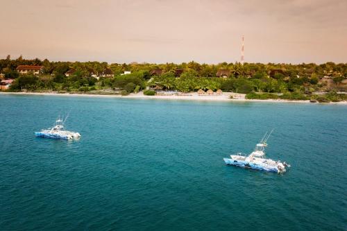 two boats in a large body of water at Vila Do Paraiso in Vilanculos