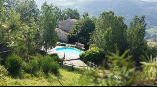 an image of a house with a swimming pool at I Casali del Buontempo in Buggiano