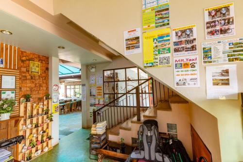 a staircase in a store with posters on the wall at Medio De Pai in Pai