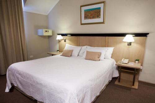 Кровать или кровати в номере Argentino Hotel