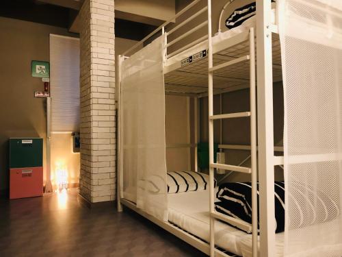 Postel nebo postele na pokoji v ubytování Sohostel Korea