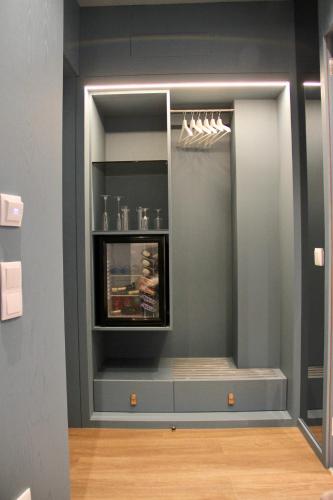 a kitchen with a counter in a wall at A Rendilheira Charm Suites in Vila do Conde