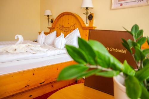 a bedroom with a bed with a swan on it at Ortner's Resort in Bad Füssing